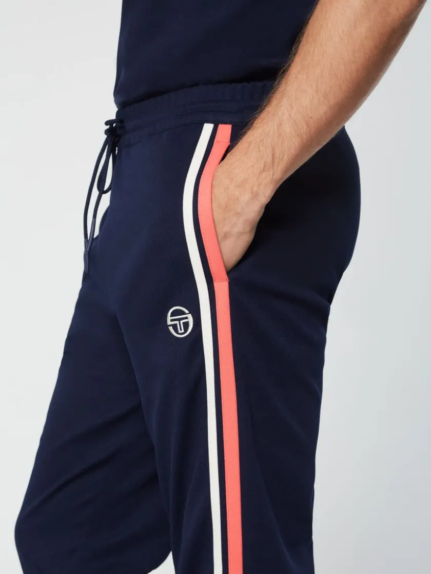 damarindo_track_pant_archivio_gardenia_maritime_blue_4-1.webp Shop Damarindo Track Pant Archivio- Gardenia/ Maritime Blue Pants And Sweatpants