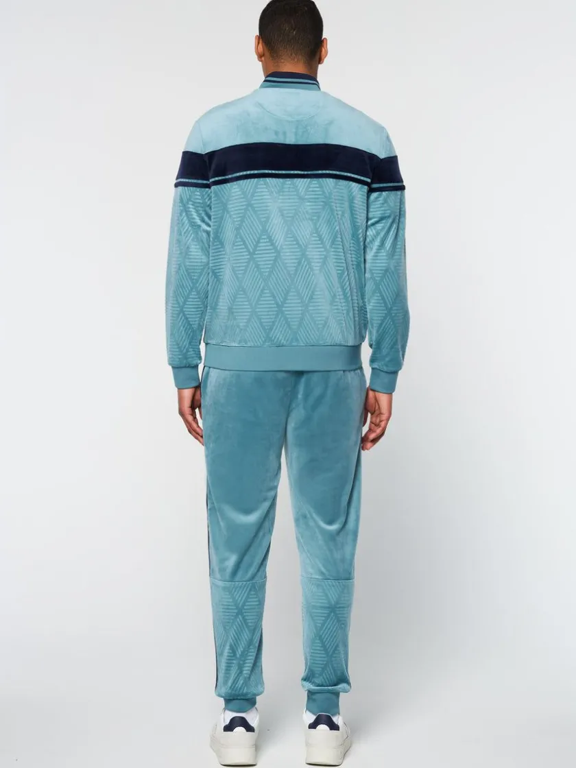 debossed_damarindo_velour_track_jacket_larkspur_3.webp Store Debossed Damarindo Velour Track Jacket- Larkspur View All