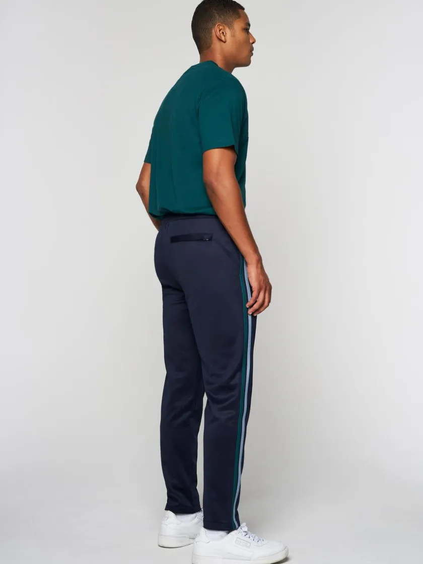 ghibli_track_pant_maritime_blue_gardenia_3.webp Shop Ghibli Track Pant- Maritime Blue/ Gardenia View All