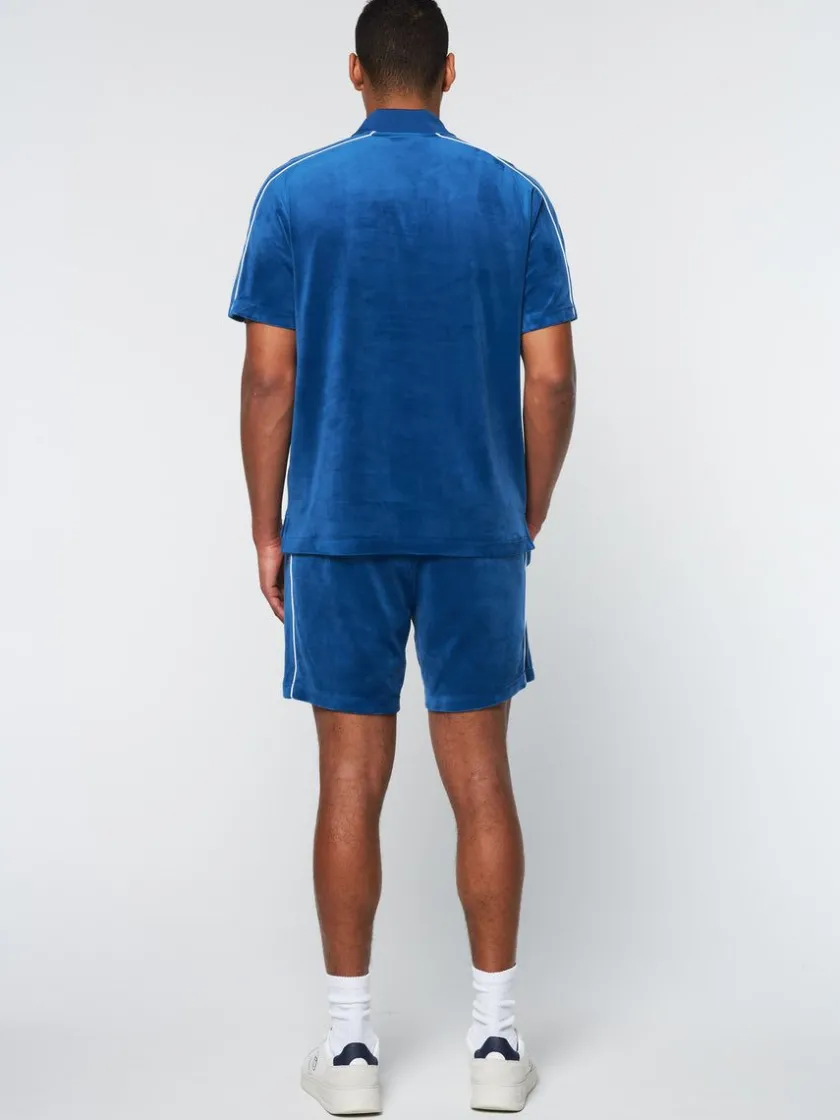 lioni_velour_polo_archivio_limoges_3-2.webp Shop Lioni Velour Polo Archivio- Limoges Polos