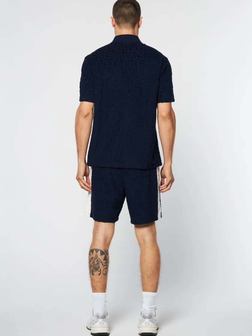 livata_monogram_polo_maritime_blue_3-1.webp Flash Sale Livata Monogram Polo- Maritime Blue Matching Separates